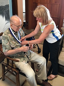 Placing the medal on Gordon Moore